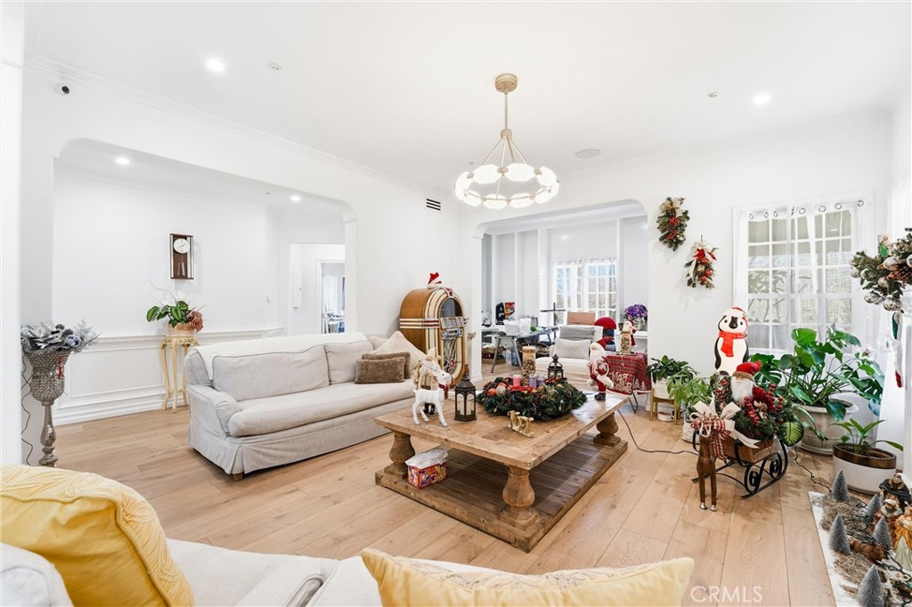 381 South Henning Way Anaheim, CA 92807 - Photo 11 of 55 a living room with furniture and a chandelier