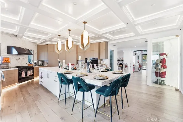 a large kitchen with a table and chairs