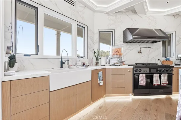 a kitchen with a sink cabinets and stainless steel appliances