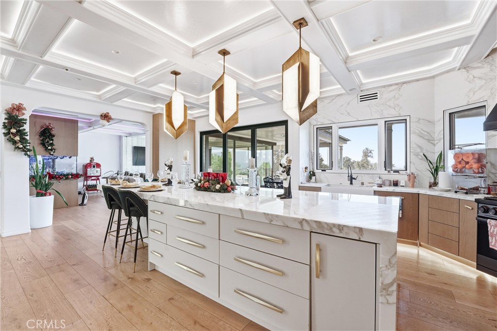381 South Henning Way Anaheim, CA 92807 - Photo 18 of 55 a kitchen with lots of counter top space and painting on the wall