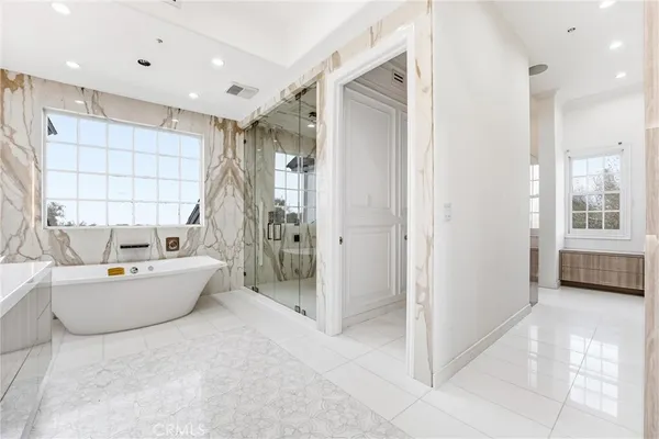 a view of a hallway with washer and dryer