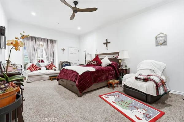 a bedroom with bed and a window