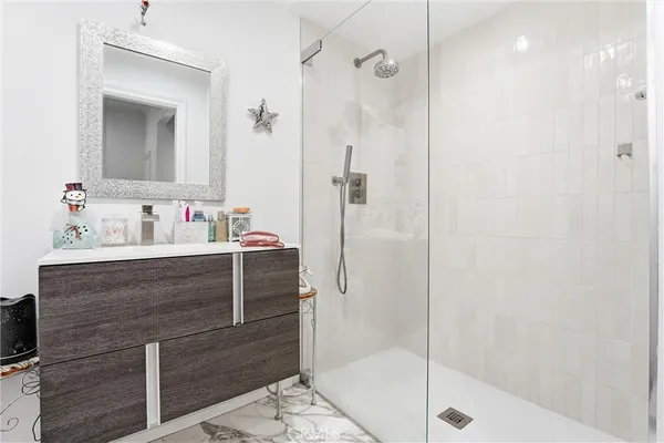 a bathroom with a toilet a sink and a mirror