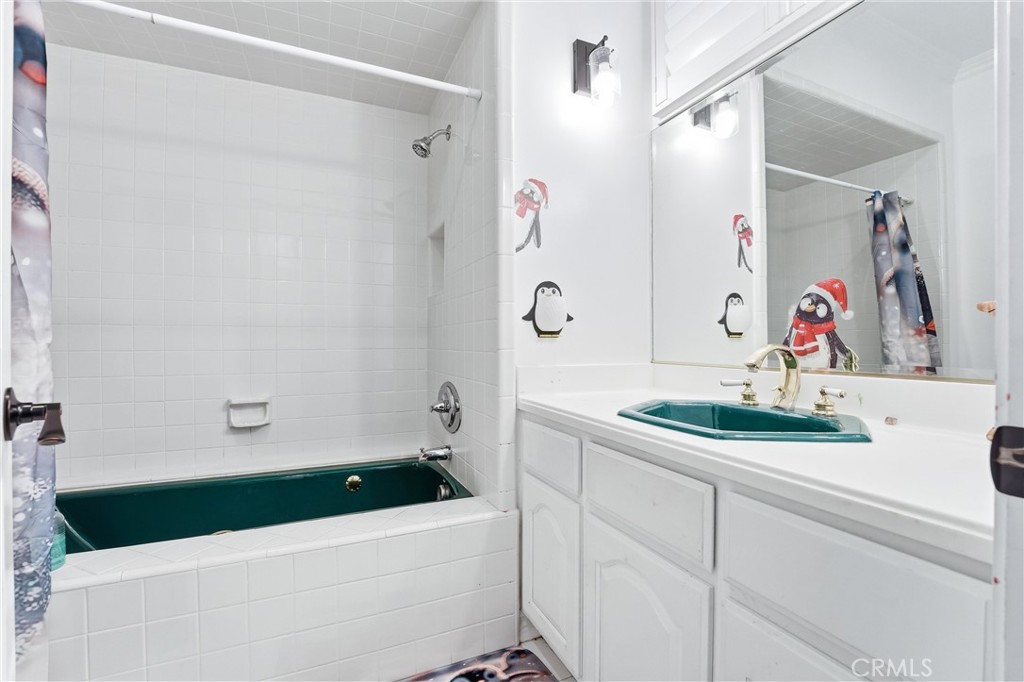 381 South Henning Way Anaheim, CA 92807 - Photo 48 of 55 a bathroom with a sink and a bathtub