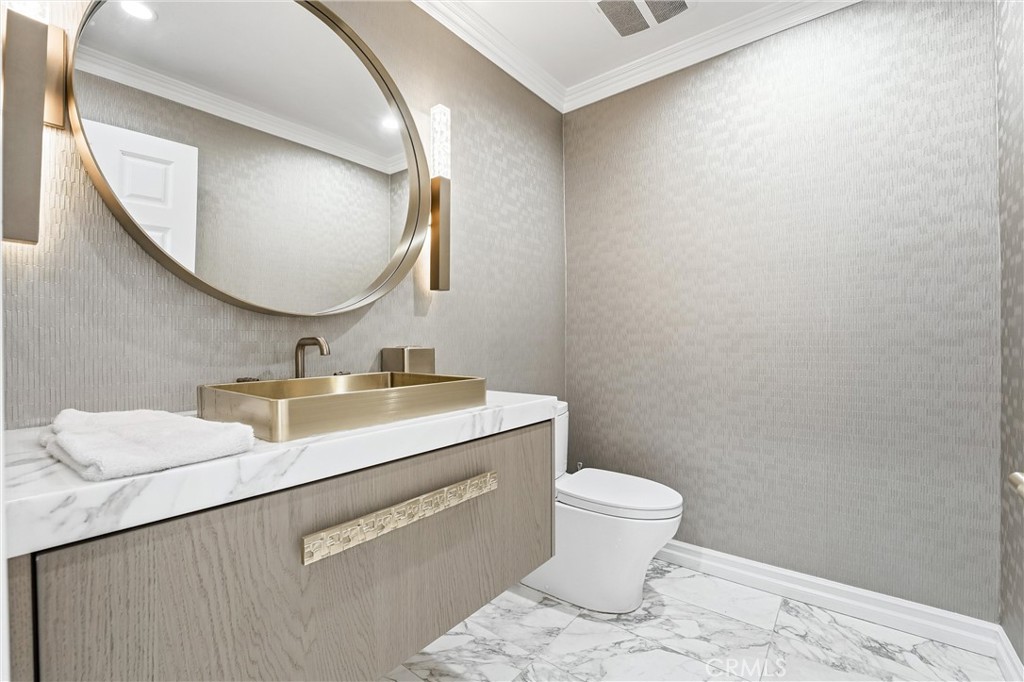 381 South Henning Way Anaheim, CA 92807 - Photo 51 of 55 a bathroom with a toilet a sink and mirror