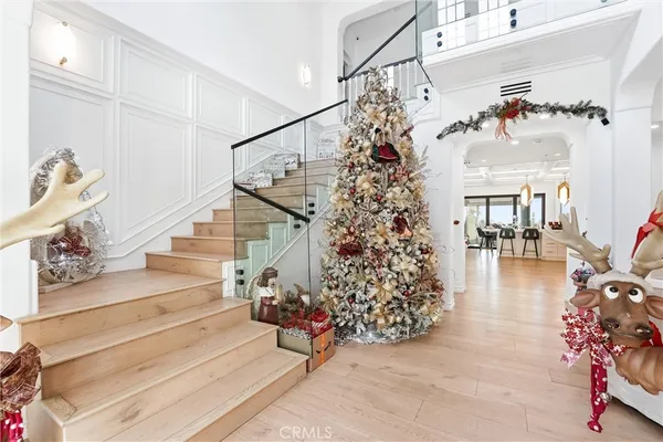 a view of entryway with hardwood and stairs