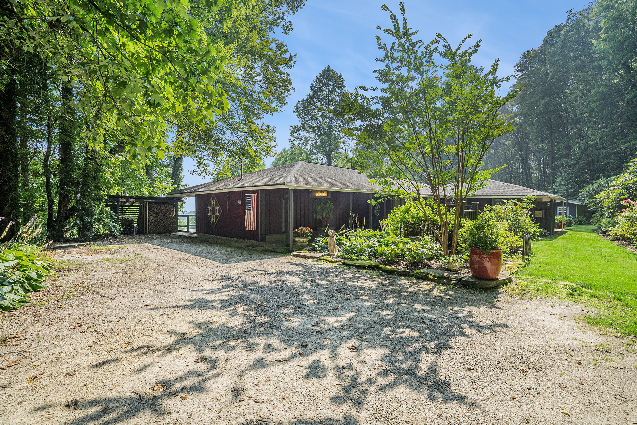 1105 Moses Road Rabun Gap, GA 30568 - Photo 1 of 1 a front view of a house with garden