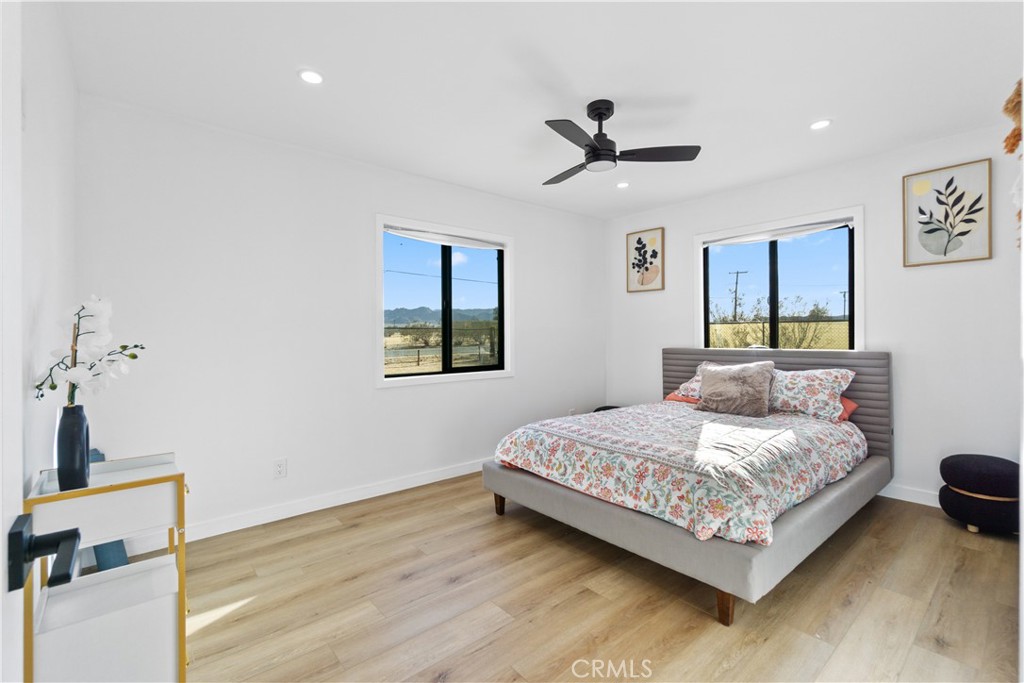 64654 Sun Mesa Road Joshua Tree, CA 92252 - Photo 11 of 25 a bedroom with a bed and a dresser