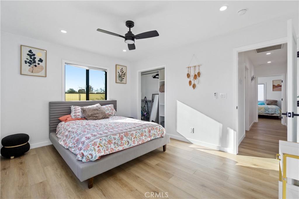64654 Sun Mesa Road Joshua Tree, CA 92252 - Photo 12 of 25 a bedroom with a bed and a walk in closet