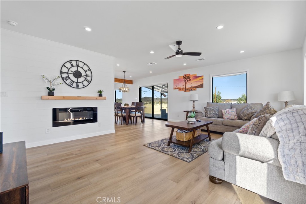 64654 Sun Mesa Road Joshua Tree, CA 92252 - Photo 2 of 25 a living room with furniture and a fireplace