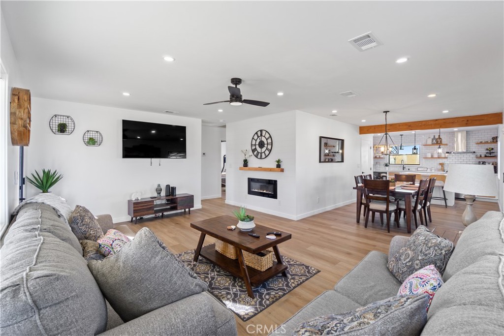 64654 Sun Mesa Road Joshua Tree, CA 92252 - Photo 4 of 25 a living room with furniture and a flat screen tv
