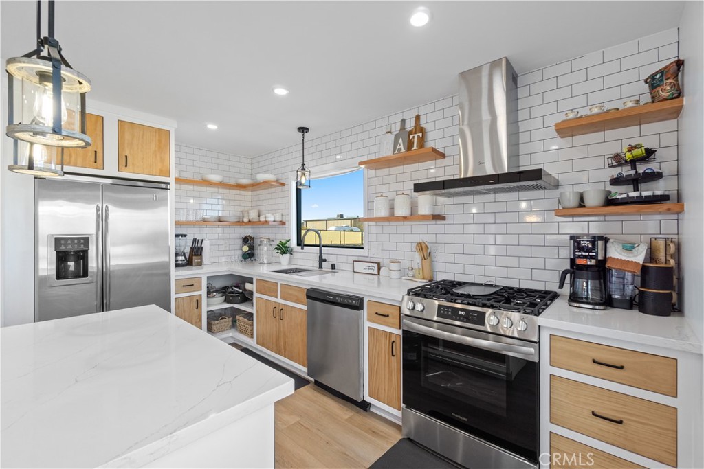 64654 Sun Mesa Road Joshua Tree, CA 92252 - Photo 8 of 25 a kitchen with cabinets and stainless steel appliances