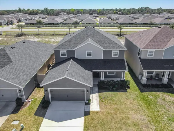 a aerial view of a house with a ocean view