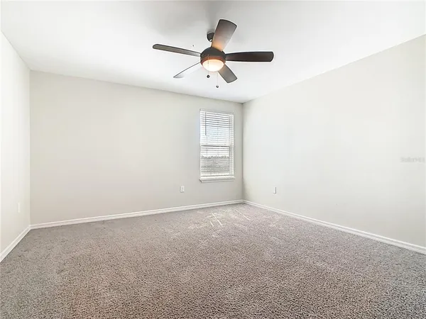 a bathroom with a double vanity sink and a window