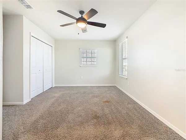 a bathroom with a granite countertop sink mirror and double