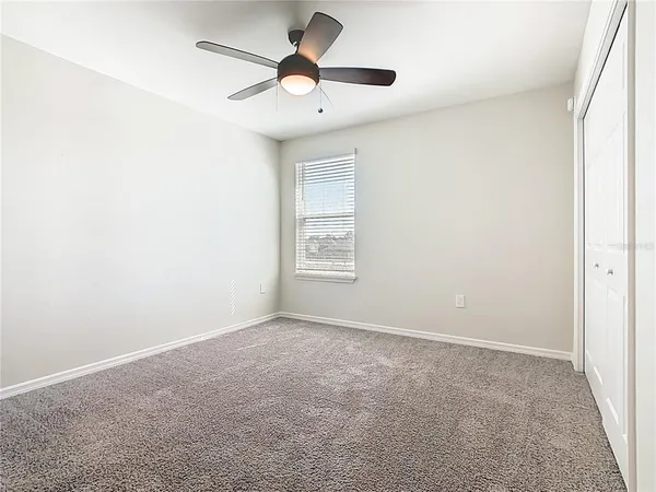 a bathroom that has a glass shower door