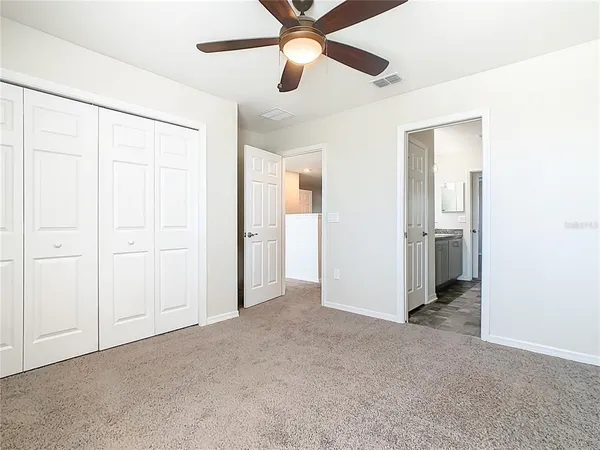 a view of a room with window and closet