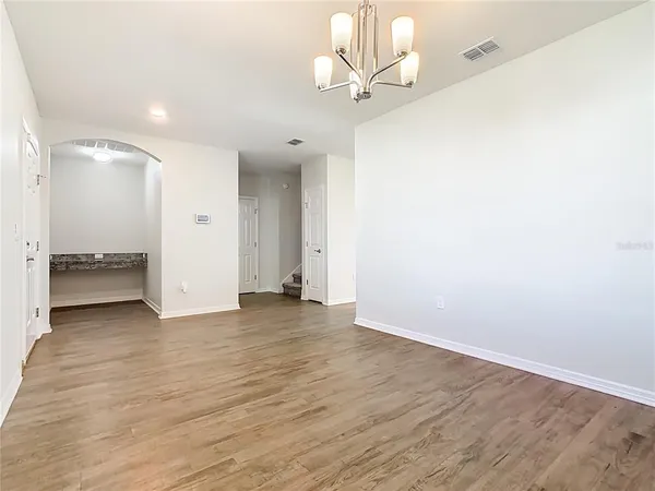a kitchen with a sink cabinets stainless steel appliances and a window