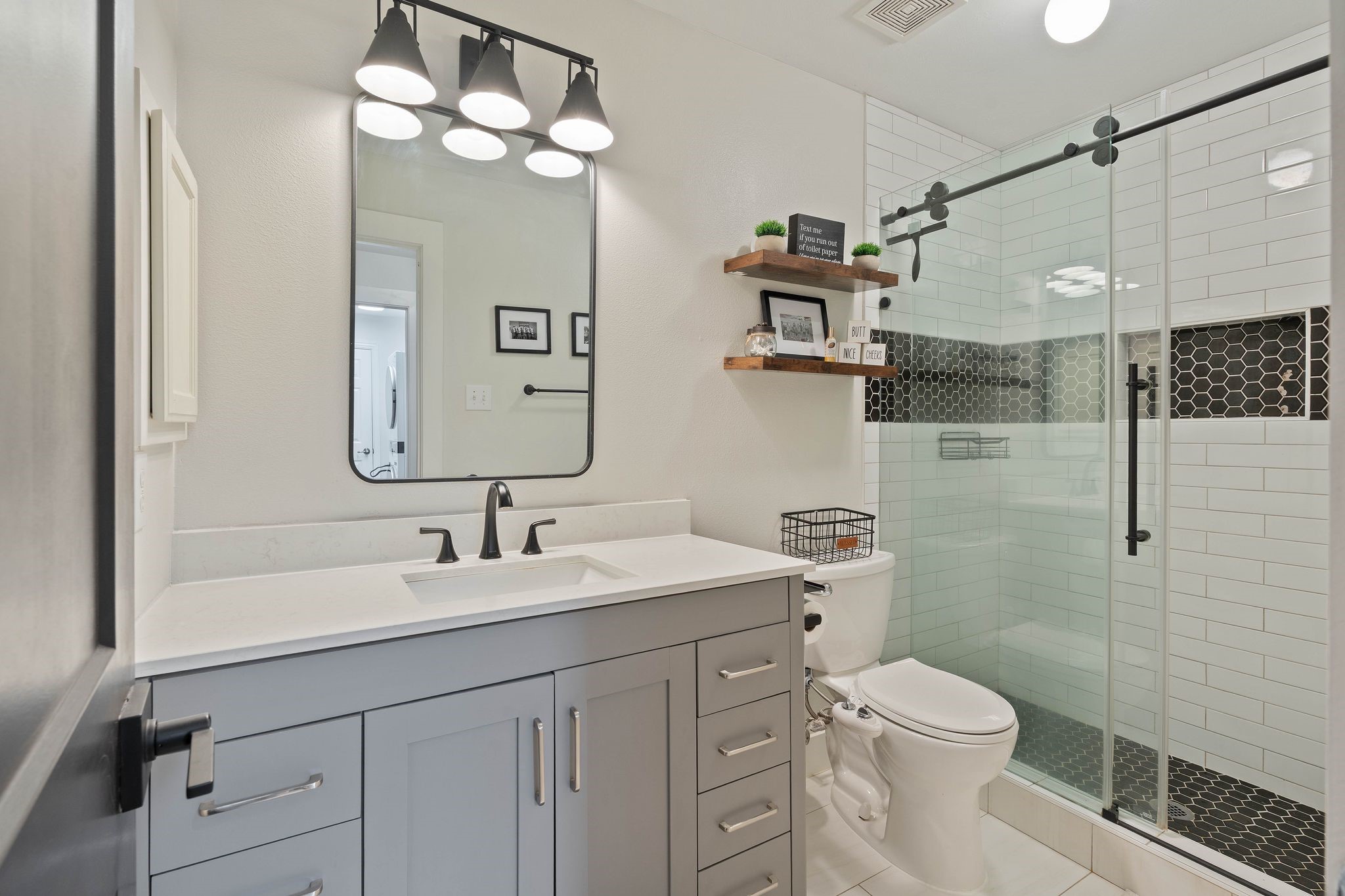 2408 Hollowbrook Lane Conroe, TX 77384 - Photo 26 of 49 Newly renovated secondary bathroom with walk in shower