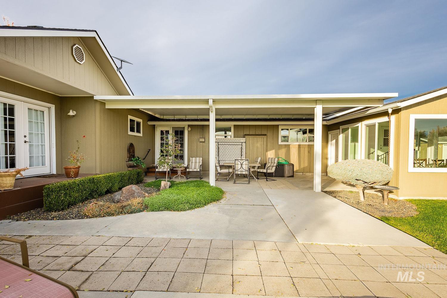 988 West King Road Kuna, ID 83634 - Photo 31 of 50 Back of house with french doors and a patio area