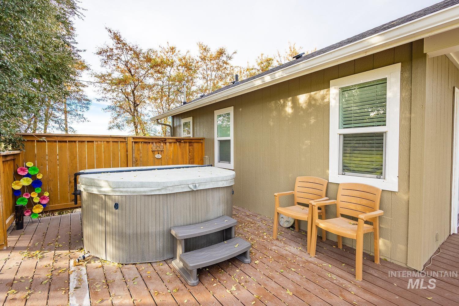 988 West King Road Kuna, ID 83634 - Photo 33 of 50 Wooden terrace featuring a hot tub
