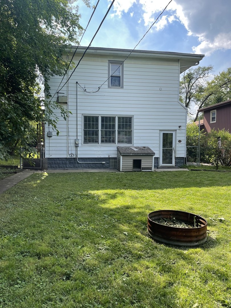Undisclosed Address Homewood, IL 60430 - Photo 2 of 2 a view of a house with a backyard