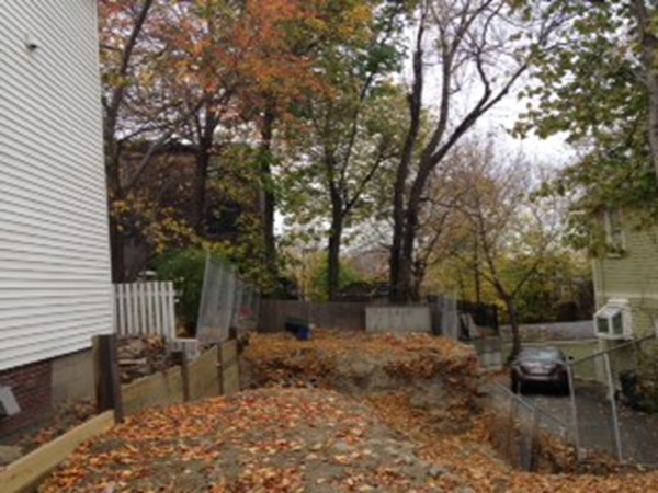 24 North Mead Street Boston, MA 02129 - Photo 1 of 1 a backyard of a house with table and chairs