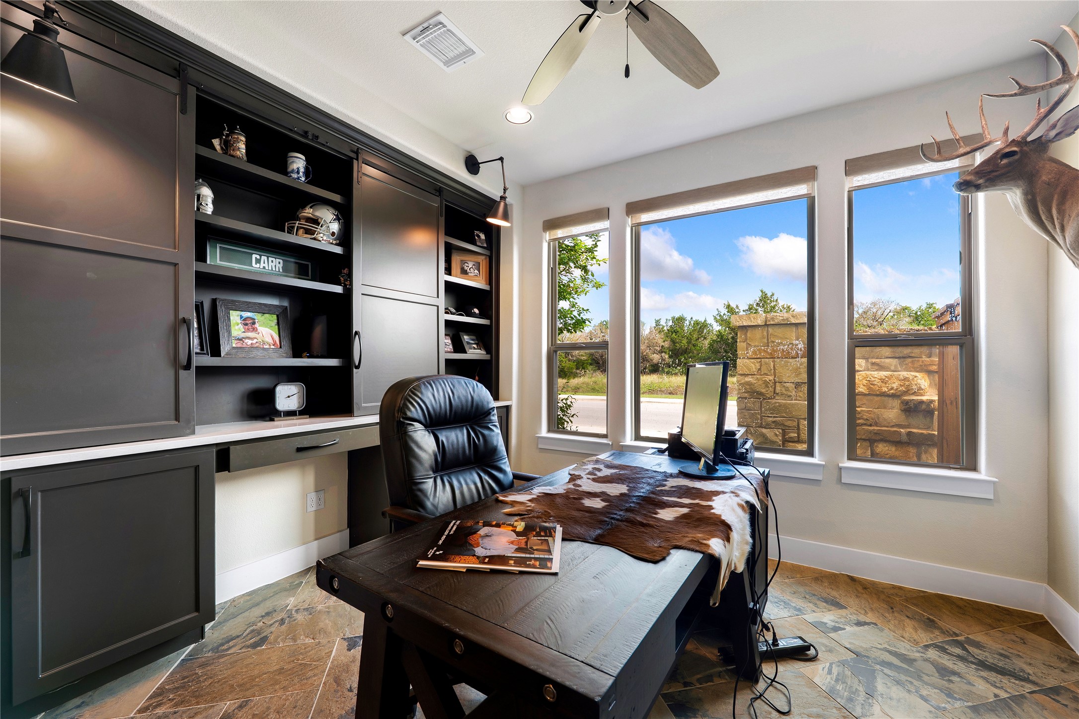 2408 Nate's Place Georgetown, TX 78633 - Photo 15 of 40 Flex area featuring custom built-ins and ample natural light define this functional and stylish office space.