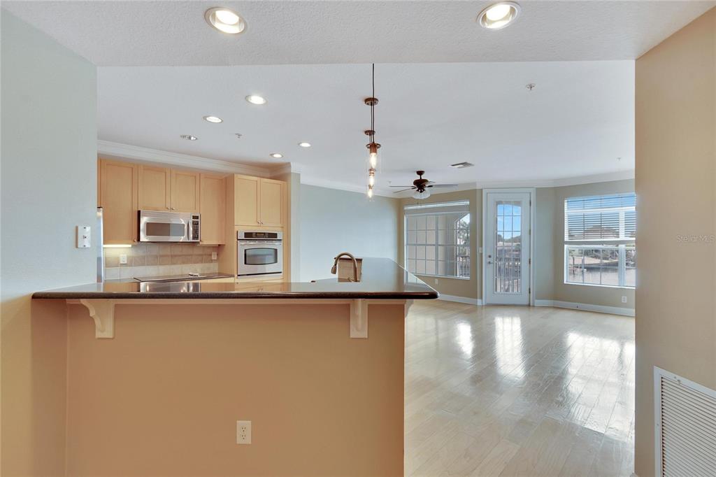 6414 Sunset Bay Circle Apollo Beach, FL 33572 - Photo 13 of 50 a view of a kitchen with a sink and window