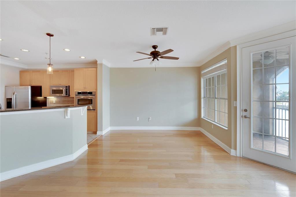 6414 Sunset Bay Circle Apollo Beach, FL 33572 - Photo 19 of 50 a view of a kitchen with kitchen island a sink stainless steel appliances and cabinets