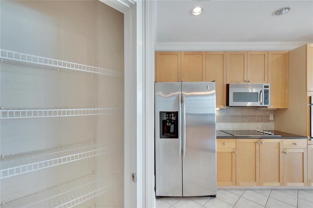 6414 Sunset Bay Circle Apollo Beach, FL 33572 - Photo 21 of 50 a kitchen with granite countertop cabinets and refrigerator