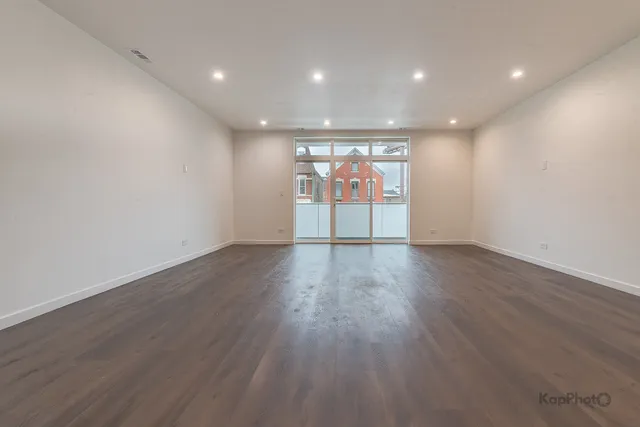 a view of room with wooden floor