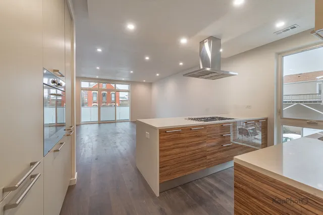 a view of cabinets and wooden floor