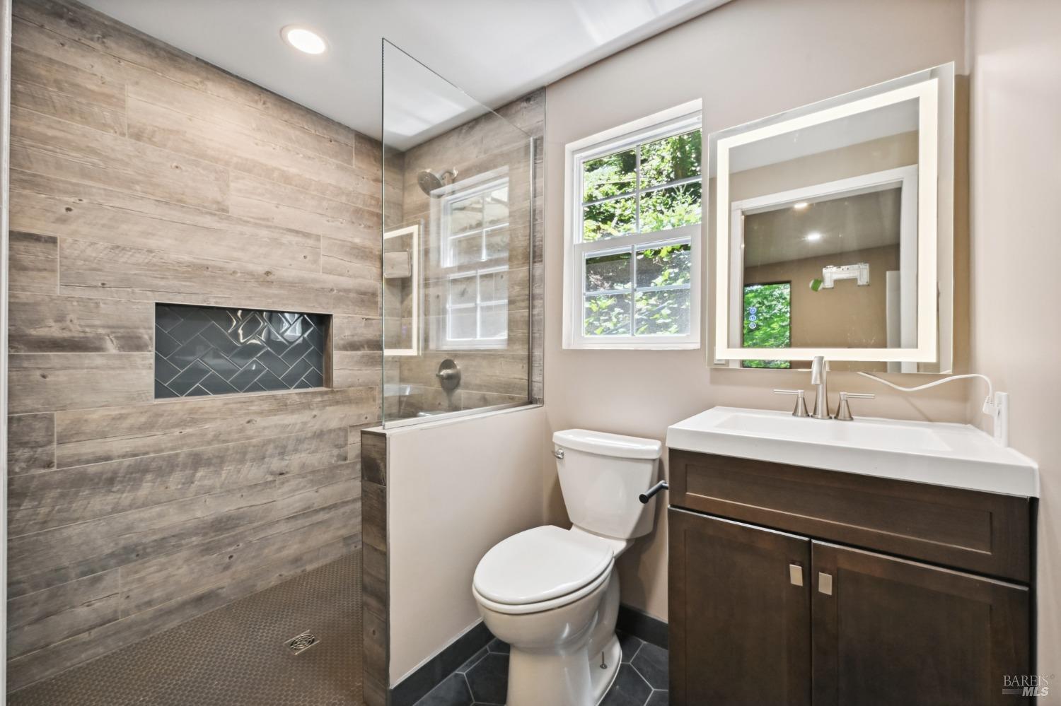 21713 Starrett Hill Drive Monte Rio, CA 95462 - Photo 28 of 50 a bathroom with a toilet sink and mirror