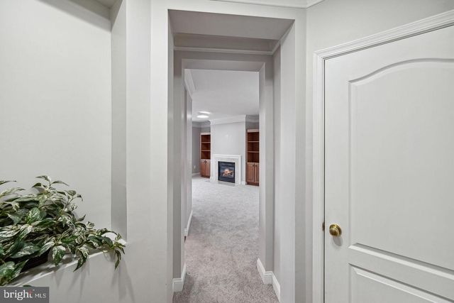 a view of a hallway to a livingroom and a hallway
