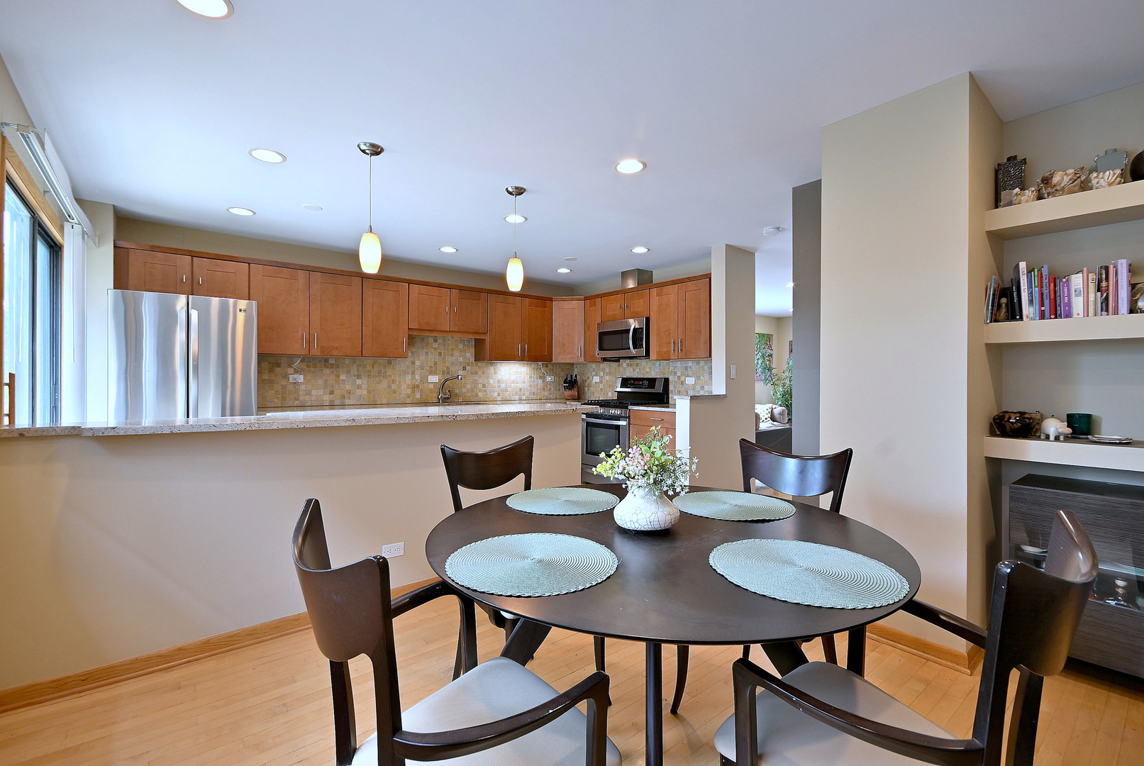 2350 North Sayre Avenue, Unit G Chicago, IL 60707 - Photo 7 of 30 a kitchen with a dining table chairs and a dining table with wooden floor