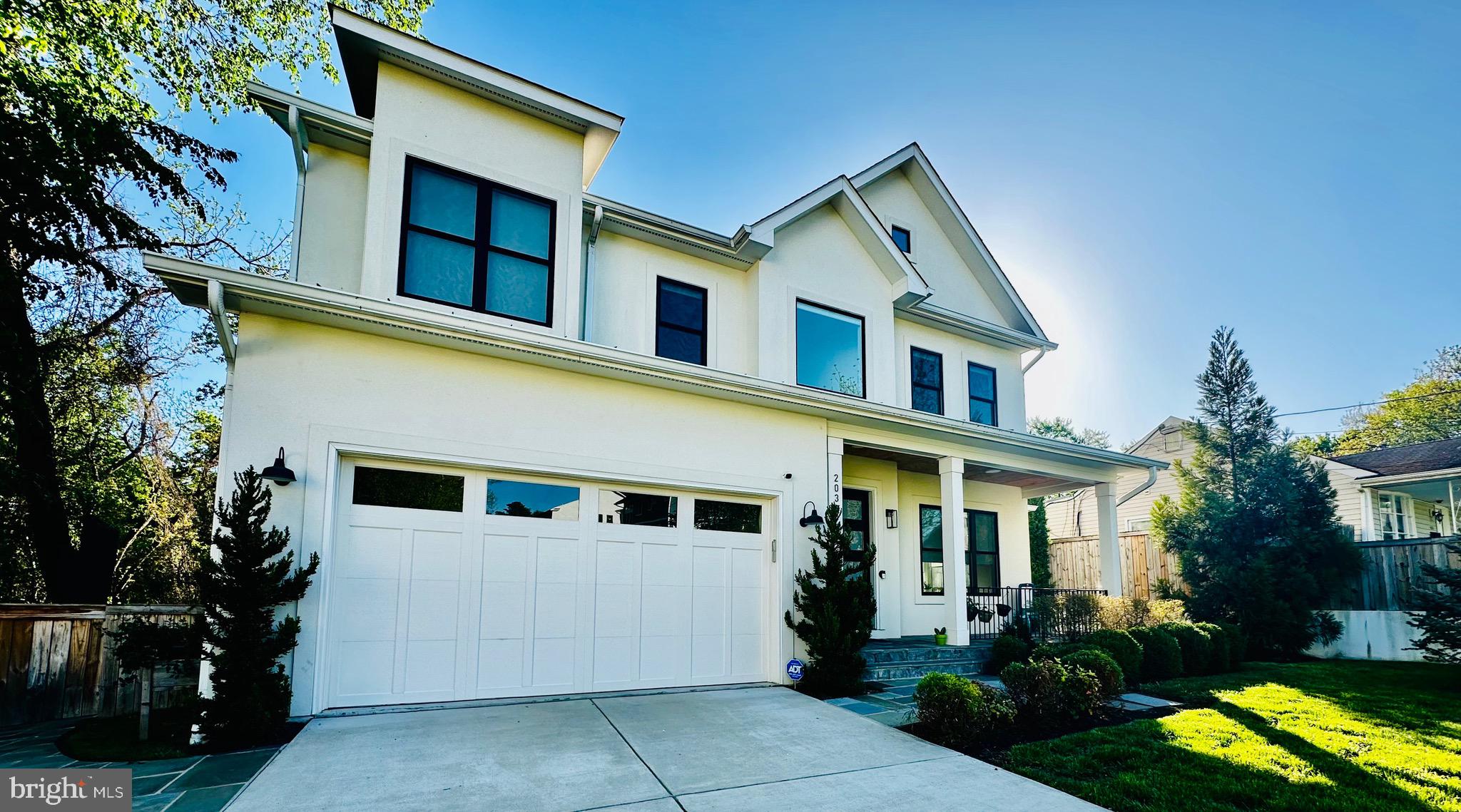 2033 Griffith Road Falls Church, VA 22043 - Photo 3 of 10 a front view of a house with a yard and outdoor seating