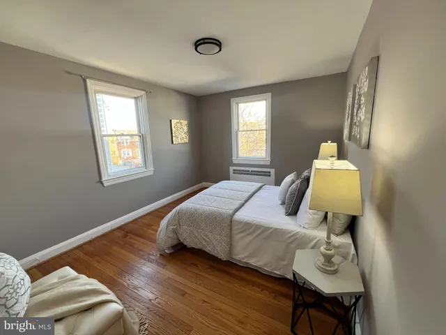 a bedroom with bed and window