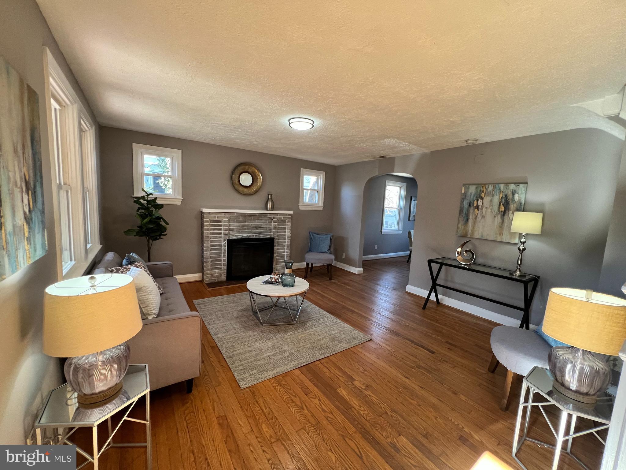 56 Yorkway Baltimore, MD 21222 - Photo 14 of 23 a living room with furniture and a fireplace