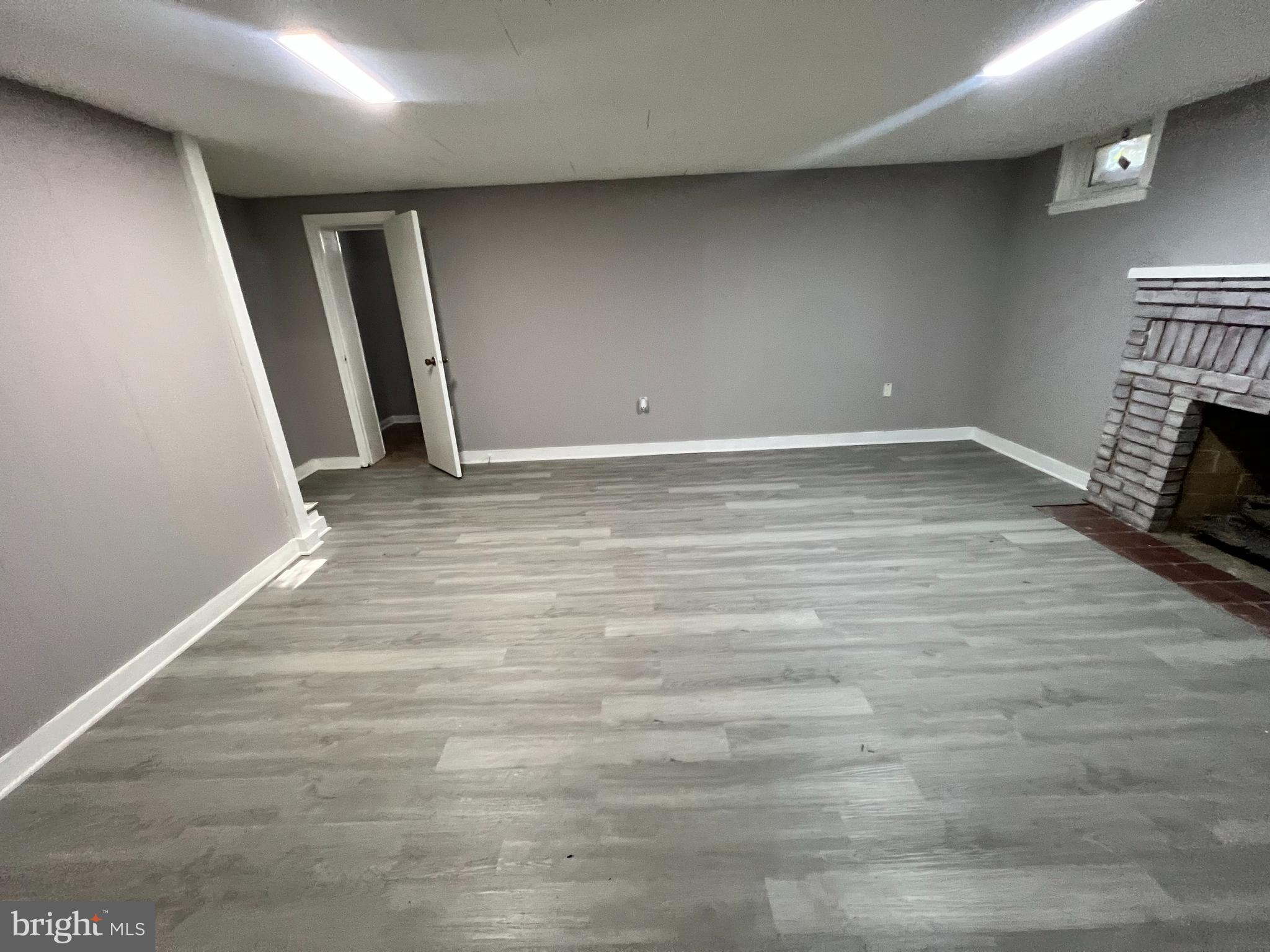 56 Yorkway Baltimore, MD 21222 - Photo 16 of 23 a view of empty room with wooden floor