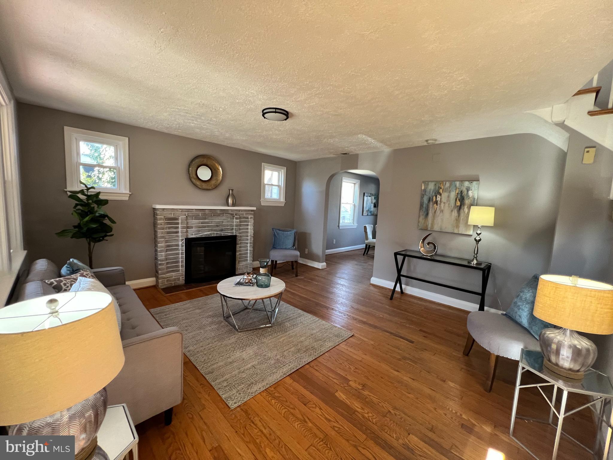 56 Yorkway Baltimore, MD 21222 - Photo 22 of 23 a living room with furniture and a fireplace