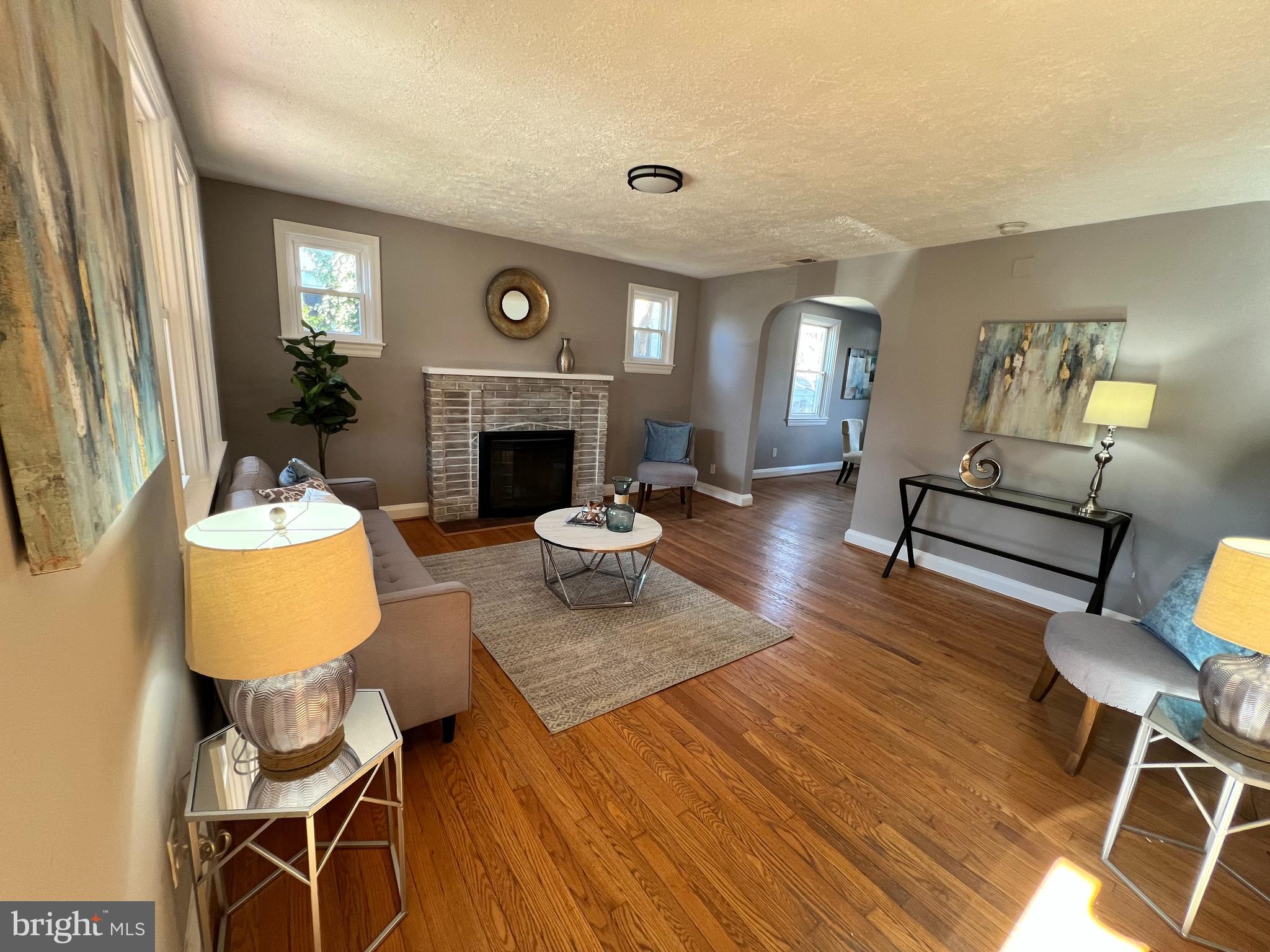 56 Yorkway Baltimore, MD 21222 - Photo 23 of 23 a living room with furniture and a fireplace