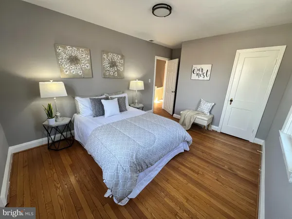a bed room with a bed and a chair