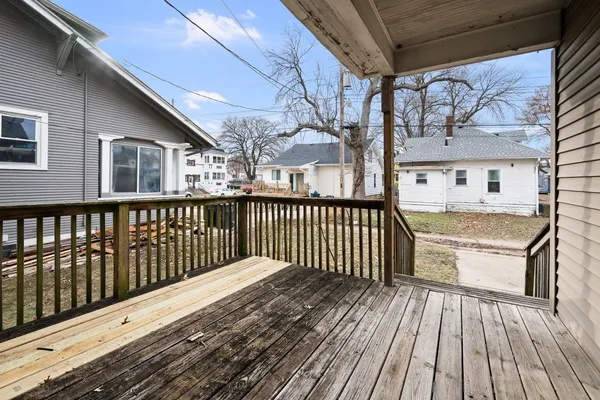 a balcony with wooden floor