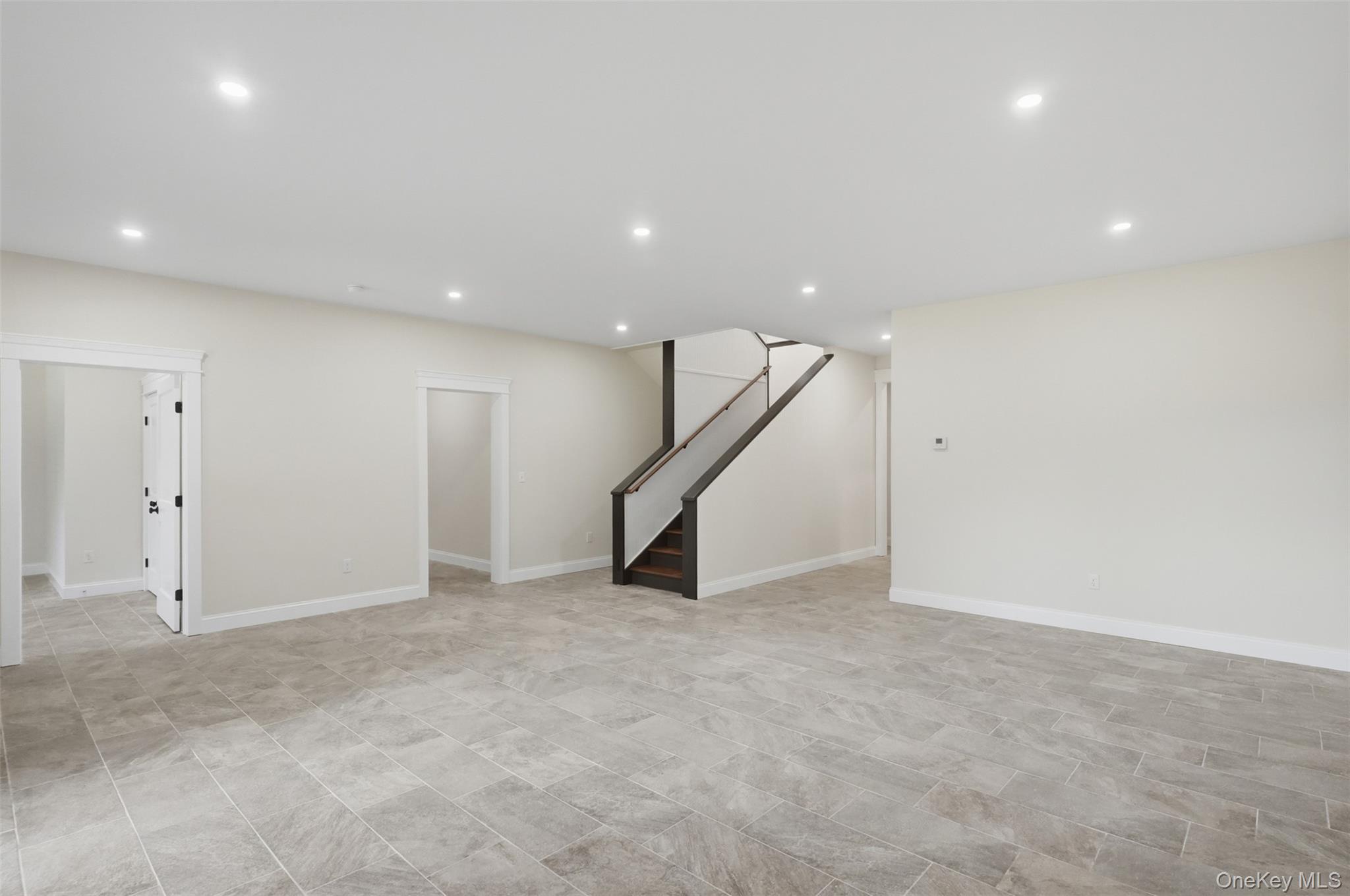 300 Van Tuyl Road Barryville, NY 12719 - Photo 40 of 50 an empty room with stairs and way to room with wooden floor