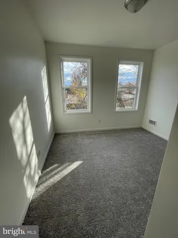 a view of an empty room and window