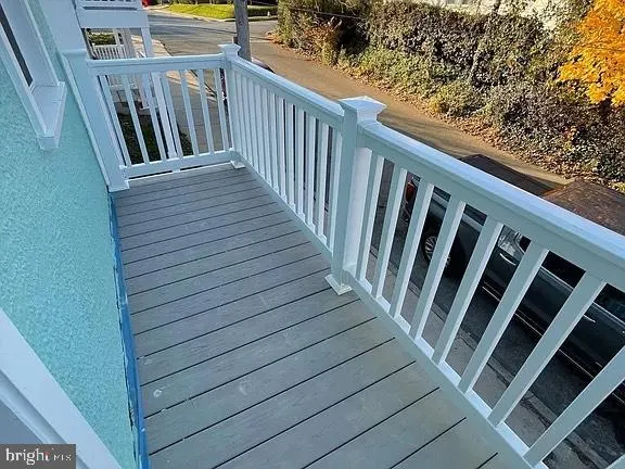 a utility room with water heater and racks