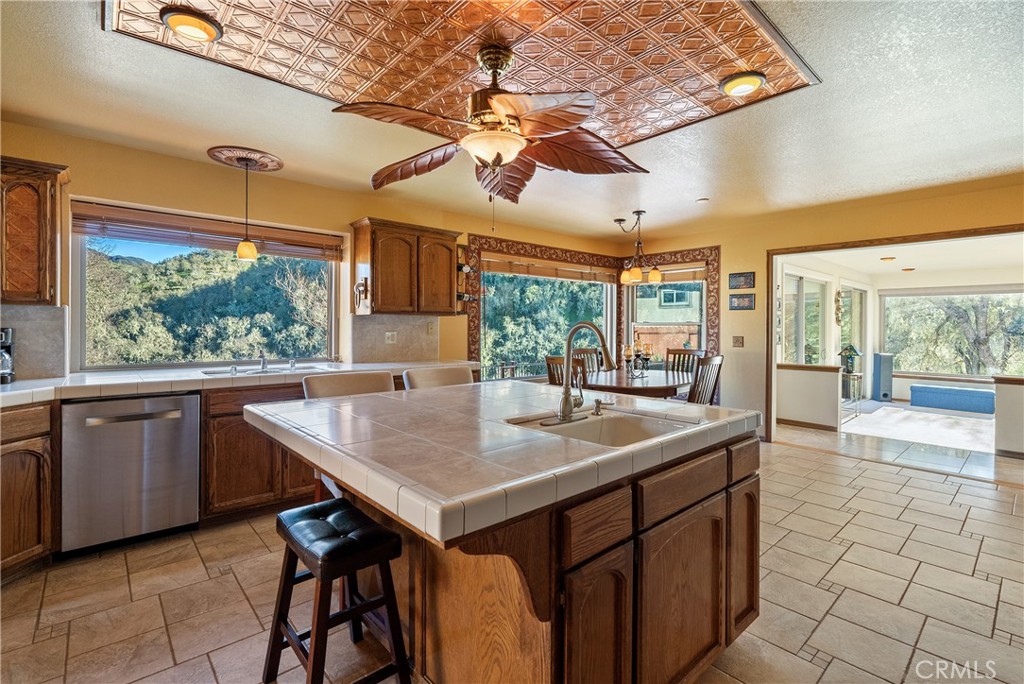 5145 Northfork Place Paso Robles, CA 93446 - Photo 18 of 62 a kitchen with a table chairs and wooden cabinets