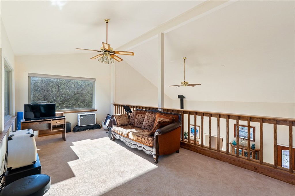 5145 Northfork Place Paso Robles, CA 93446 - Photo 35 of 62 a living room with furniture ceiling fan and a window