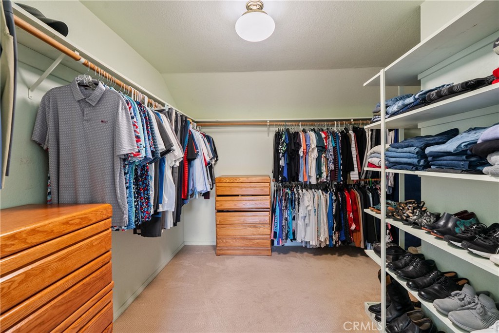 5145 Northfork Place Paso Robles, CA 93446 - Photo 38 of 62 a view of walk in closet with clothes and shoes